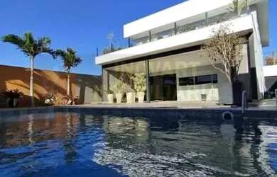 Imagem: A casa possui 4 Dormitórios, 4 Banheiros, 2 Vagas na garagem