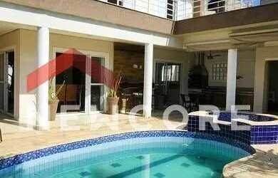 Imagem: A casa possui 4 Dormitórios, 5 Banheiros, 5 Vagas na garagem