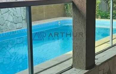 Imagem: A casa possui 3 Dormitórios, 3 Banheiros, 3 Vagas na garagem