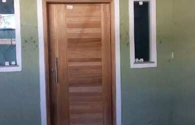 Imagem: A casa possui 2 Dormitórios, 1 Banheiro, 2 Vagas na garagem