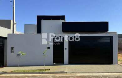 Imagem: A casa possui 3 Dormitórios, 3 Banheiros, 2 Vagas na garagem