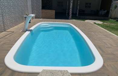 Imagem: A casa possui 2 Dormitórios, 4 Vagas na garagem e está localizado