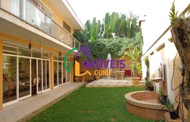 Imagem: A casa possui 4 Dormitórios, 4 Banheiros, 4 Vagas na garagem