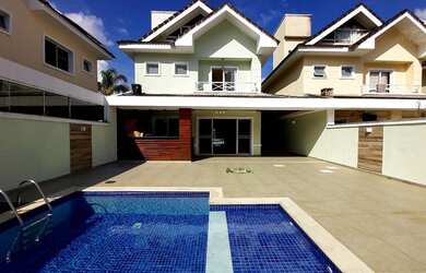 Imagem: A casa em condomínio possui 4 Dormitórios, 4 Banheiros, 3