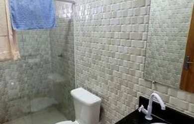 Imagem: A casa possui 3 Dormitórios, 4 Banheiros, 2 Vagas na garagem