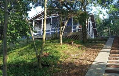 Imagem: A casa possui 2 Dormitórios, 1 Banheiro, 2 Vagas na garagem