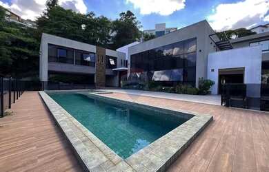 Imagem: A casa em condomínio possui 4 Dormitórios, 5 Banheiros, 5