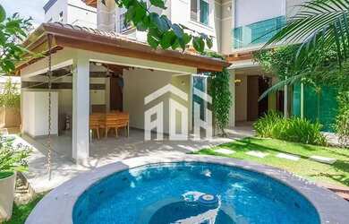 Imagem: A casa possui 4 Dormitórios, 5 Banheiros, 4 Vagas na garagem