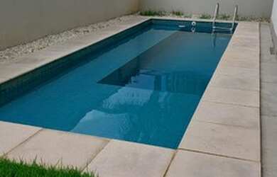 Imagem: A casa em condomínio possui 4 Dormitórios, 5 Banheiros, 2