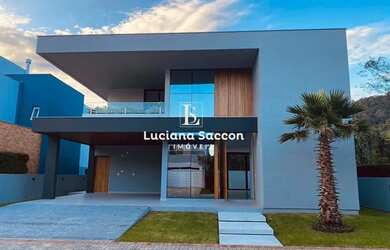 Imagem: A casa em condomínio possui 4 Dormitórios, 4 Banheiros, 2