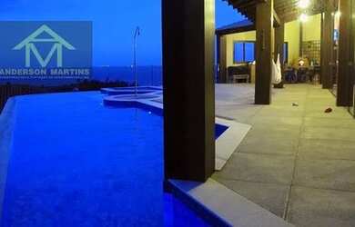 Imagem: A casa possui 4 Dormitórios, 4 Banheiros, 5 Vagas na garagem