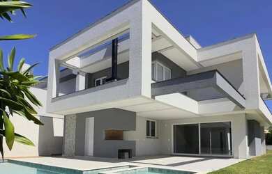 Imagem: A casa possui 4 Dormitórios, 4 Banheiros, 4 Vagas na garagem