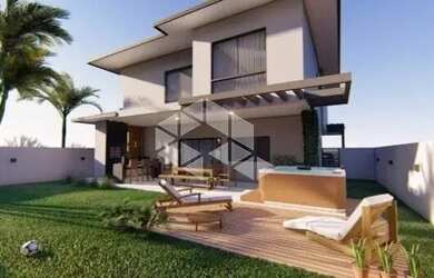 Imagem: A casa possui 3 Dormitórios, 4 Banheiros, 2 Vagas na garagem