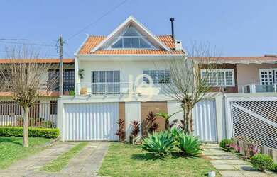 Imagem: A casa possui 4 Dormitórios, 4 Banheiros, 2 Vagas na garagem