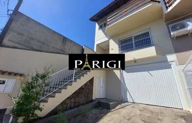 Imagem: A casa possui 3 Dormitórios, 2 Banheiros, 2 Vagas na garagem