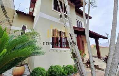 Imagem: A casa possui 3 Dormitórios, 4 Banheiros, 3 Vagas na garagem