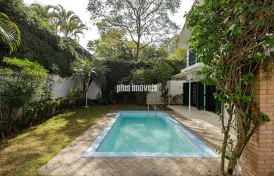 Imagem: A casa possui 3 Dormitórios, 5 Banheiros, 4 Vagas na garagem