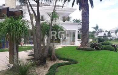 Imagem: A casa possui 5 Dormitórios, 5 Banheiros, 3 Vagas na garagem