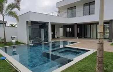 Imagem: A casa em condomínio possui 5 Dormitórios, 5 Banheiros, 4