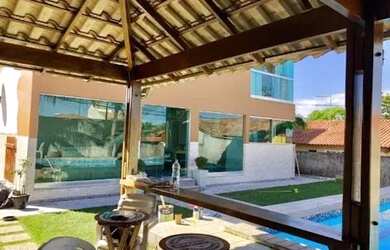 Imagem: A casa possui 3 Dormitórios, 4 Banheiros, 4 Vagas na garagem