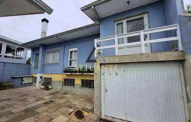 Imagem: A casa possui 4 Dormitórios, 4 Banheiros, 4 Vagas na garagem