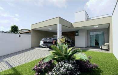 Imagem: A casa possui 3 Dormitórios, 2 Banheiros, 2 Vagas na garagem