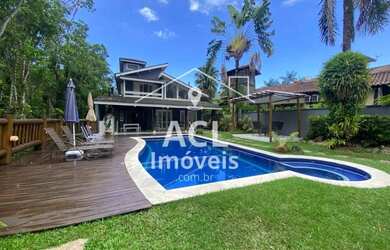 Imagem: A casa possui 4 Dormitórios, 4 Banheiros, 4 Vagas na garagem