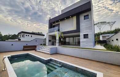 Imagem: A casa em condomínio possui 3 Dormitórios, 5 Banheiros, 2