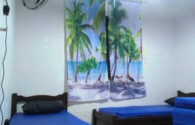 Imagem: A casa possui 2 Dormitórios, 2 Vagas na garagem e está localizado