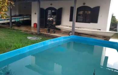 Imagem: A casa à venda possui 4 Dormitórios, 2 Banheiros, 5 Vagas