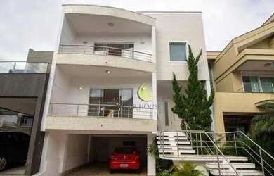 Imagem: A casa possui 3 Dormitórios, 4 Banheiros, 4 Vagas na garagem