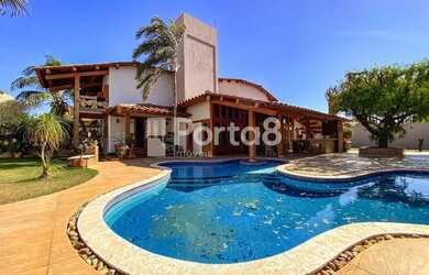 Imagem: A casa possui 4 Dormitórios, 5 Banheiros, 5 Vagas na garagem