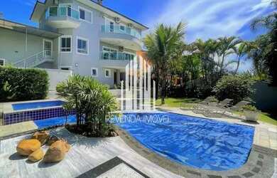 Imagem: A casa em condomínio possui 4 Dormitórios, 5 Banheiros, 4