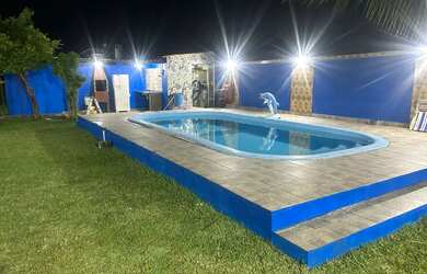 Imagem: A casa possui 3 Dormitórios, 4 Banheiros, 5 Vagas na garagem