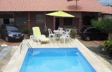 Imagem: A casa para temporada possui 3 Dormitórios e 5 Vagas na garagem