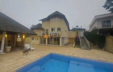 Imagem: A casa em condomínio possui 4 Dormitórios, 5 Banheiros, 4