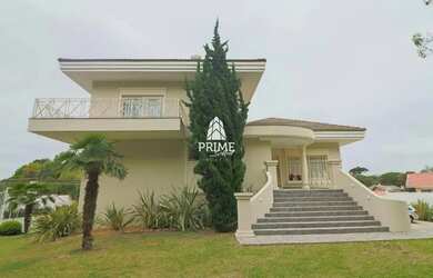 Imagem: A casa possui 4 Dormitórios, 5 Banheiros, 5 Vagas na garagem