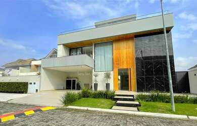 Imagem: A casa possui 5 Dormitórios, 5 Banheiros, 3 Vagas na garagem