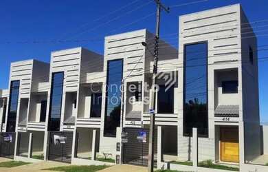 Imagem: A casa possui 3 Dormitórios, 2 Banheiros, 2 Vagas na garagem