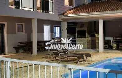 Imagem: A casa possui 3 Dormitórios, 4 Banheiros, 2 Vagas na garagem