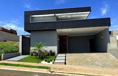 Imagem: A casa possui 3 Dormitórios, 5 Banheiros, 4 Vagas na garagem