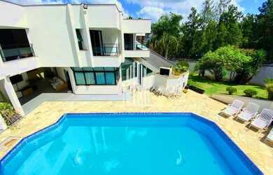 Imagem: A casa em condomínio possui 4 Dormitórios, 5 Banheiros, 5