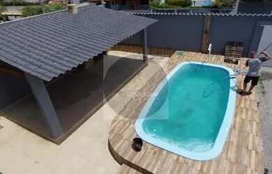 Imagem: A casa possui 4 Dormitórios, 4 Banheiros, 4 Vagas na garagem