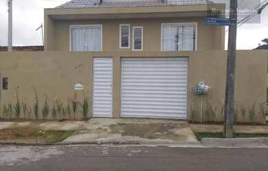 Imagem: A casa possui 4 Dormitórios, 1 Banheiro, 2 Vagas na garagem