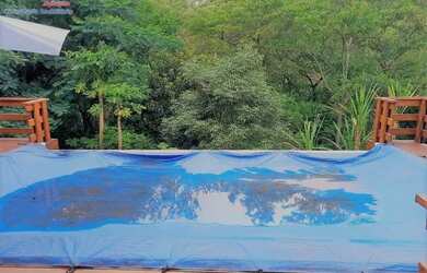 Imagem: A casa possui 4 Dormitórios, 5 Banheiros, 4 Vagas na garagem