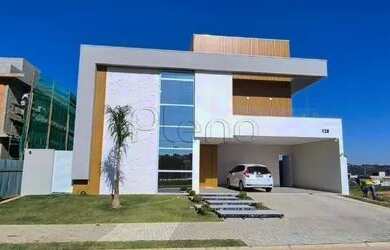 Imagem: A casa possui 3 Dormitórios, 2 Banheiros, 4 Vagas na garagem