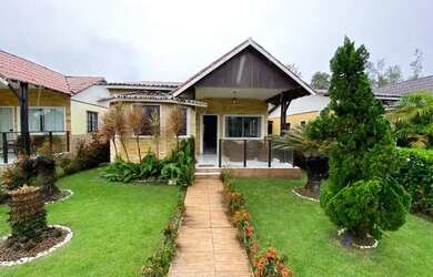 Imagem: A casa possui 3 Dormitórios, 2 Vagas na garagem e está localizado