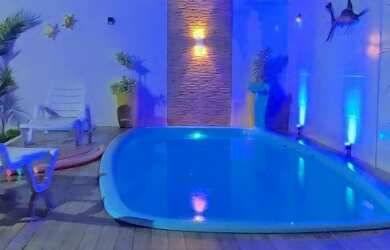 Imagem: A casa possui 4 Dormitórios, 3 Vagas na garagem e está localizado