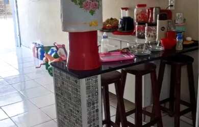 Imagem: A casa possui 3 Dormitórios, 2 Vagas na garagem e está localizado