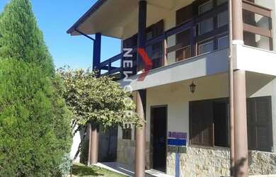 Imagem: A casa possui 4 Dormitórios, 2 Banheiros, 1 Vaga na garagem